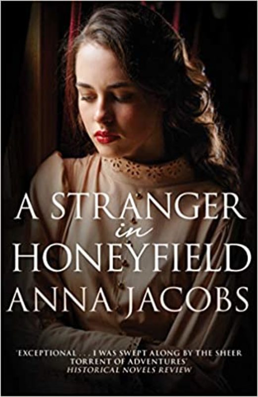 Book cover for "A Stranger in Honeyfield" by Anna Jacobs