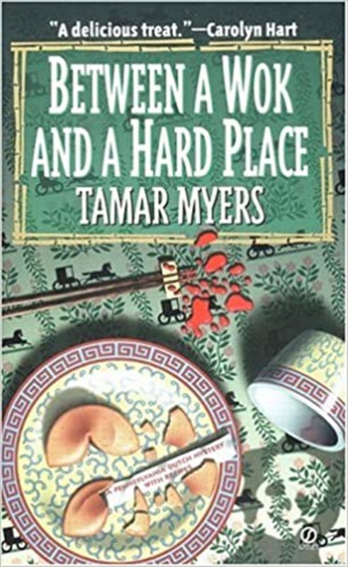 Book cover for "Between a Wok and a Hard Place" by Tamar Myers