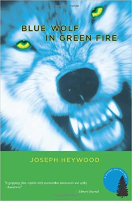 Book cover for "Blue Wolf In Green Fire" by Joseph Heywood