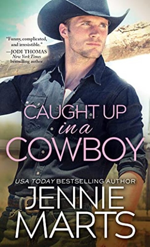 Book cover for "Caught Up in a Cowboy" by Jennie Marts