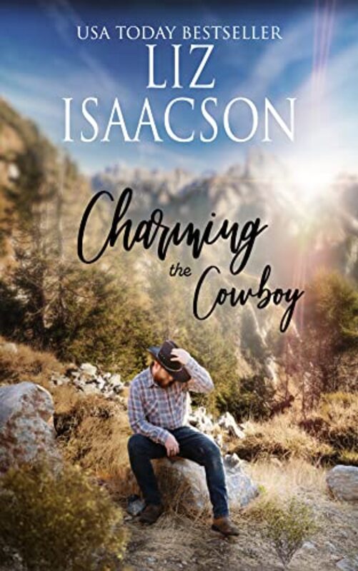 Book cover for "Charming the Cowboy" by Liz Isaacson