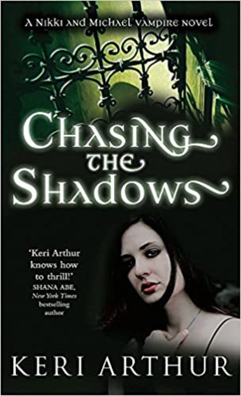 Book cover for "Chasing the Shadows" by Keri Arthur