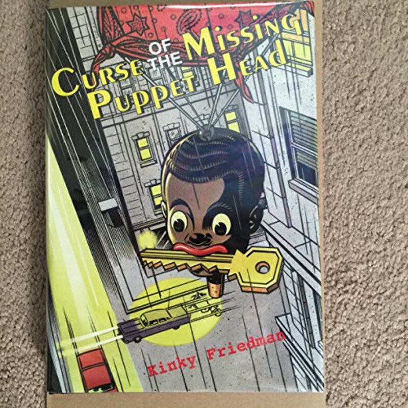 Book cover for "Curse of the Missing Puppet Head" by Kinky Friedman