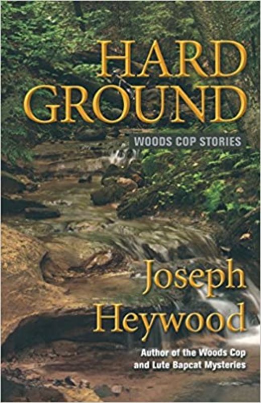 Book cover for "Hard Ground" by Joseph Heywood