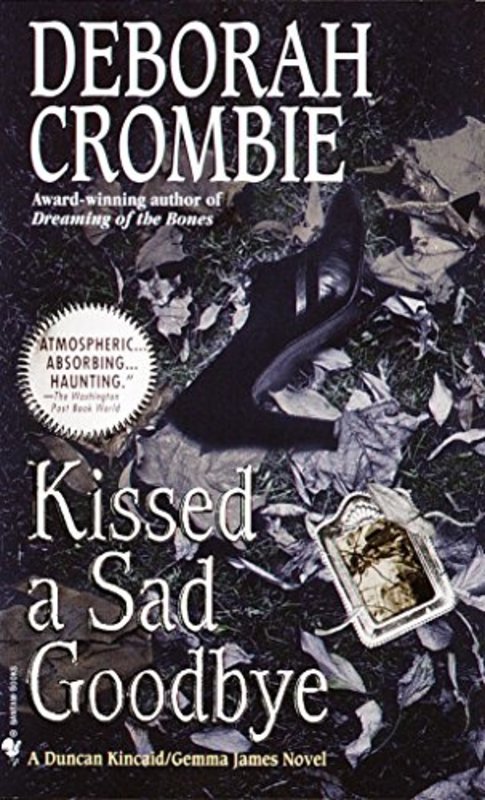 Book cover for "Kissed a Sad Goodbye" by Deborah Crombie