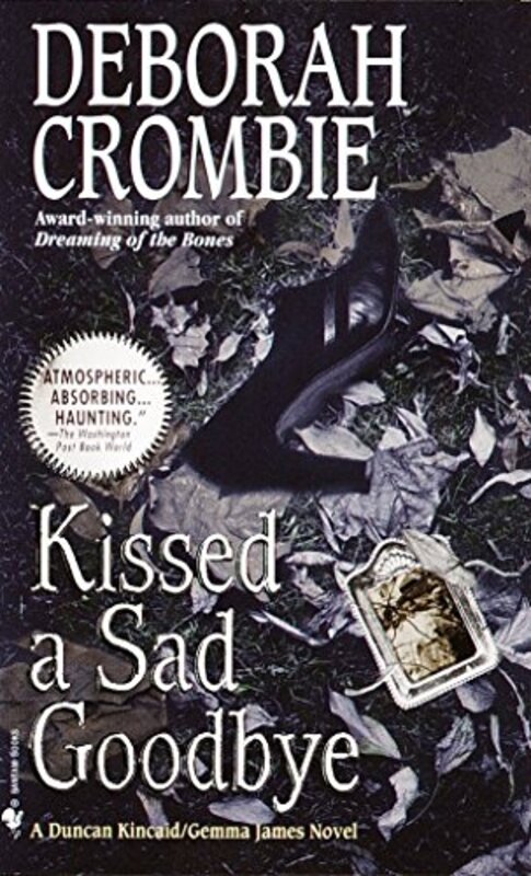 Book cover for "Kissed a Sad Goodbye" by Deborah Crombie