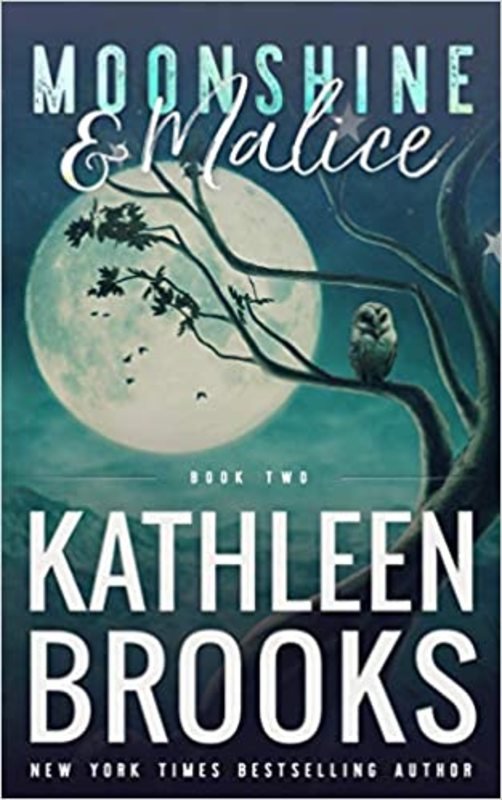 Book cover for "Moonshine & Malice" by Kathleen Brooks