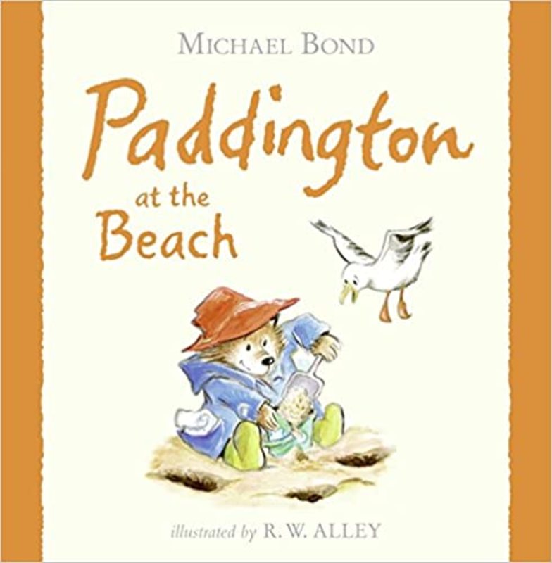 Book cover for "Paddington at the Beach" by Michael Bond