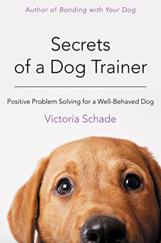 Book cover for "Secrets of a Dog Trainer" by Victoria Schade