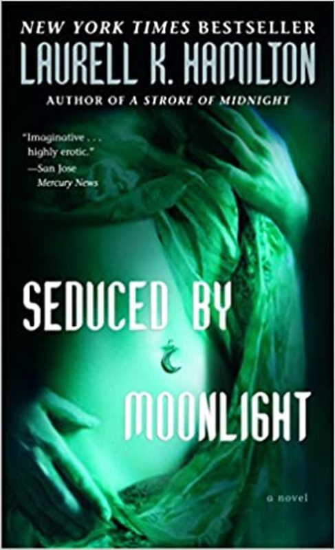 Book cover for "Seduced by Moonlight" by Laurell K. Hamilton