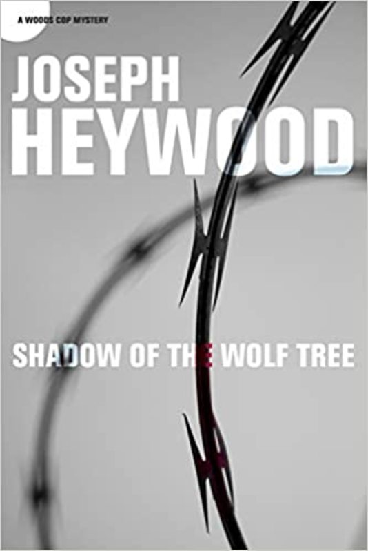 Book cover for "Shadow of the Wolf Tree" by Joseph Heywood