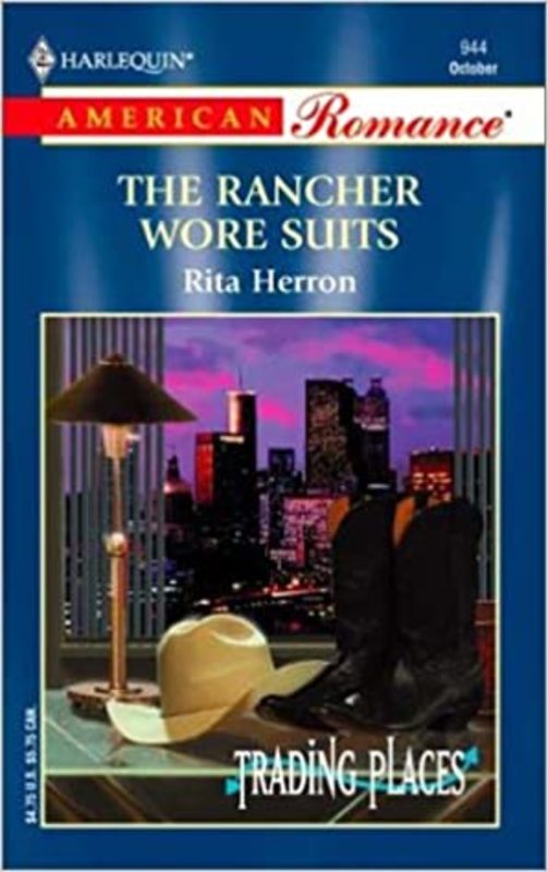 Book cover for "The Rancher Wore Suits" by Rita Herron