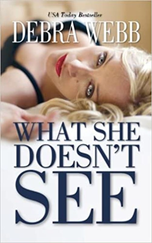Book cover for "What She Doesn't See" by Debra Webb