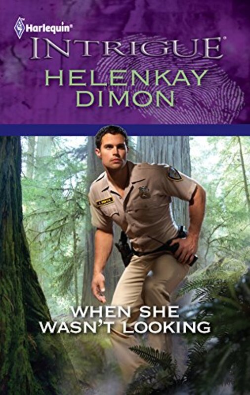 Book cover for "When She Wasn't Looking" by HelenKay Dimon