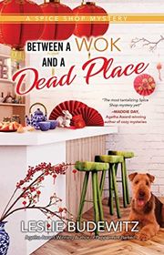 Book cover for "Between a Wok and a Dead Place" by Leslie Ann Budewitz