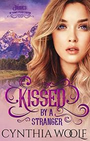 Book cover for "Kissed by a Stranger" by Cynthia Woolf