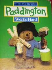 Book cover for "Paddington Works Hard" by Michael Bond